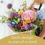 Hand tied bouquet made with seasonal flowers image
