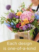 Hand-tied bouquet made with seasonal flowers image