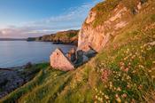 Old fishing cottage beneath the cliffs at Kinbane Head, Ballycastle, Country Antrim, Northern Ireland.