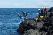 Coasteering at the Sloc, Dunseverick, Causeway Coast, Country Antrim, Northern Ireland.