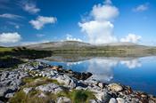 The landscape of The Burren reflected in Ballyvaghan Bay, Co Clare, Ireland. image