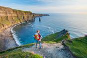 Walker at the Cliffs of Moher, County Clare, Ireland.
