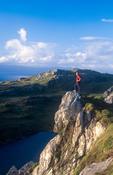 Walker looking over Lough Akeen, Sheep's Head Way, Co Cork, Ireland. image
