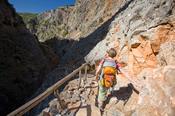 Hiker descending the Aradena Gorge, White Mountains, Crete, Greece.