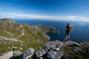 Walker looking towards Bunglas from the summit of Slieve League, County Donegal, Ireland.