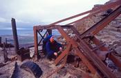 Walker and old mine machinery on the slopes of Muckish Mountain, County Donegal, Ireland.