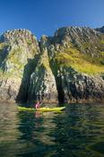 Sea kayaking benath Horn Head, County Donegal, Ireland.