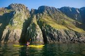 Sea kayaking benath Horn Head, County Donegal, Ireland.