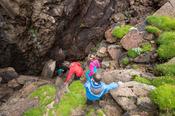 Descending into Poll a Chorra cave, Owey Island, County Donegal, Ireland.