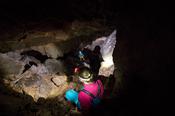 Descending into Poll a Chorra cave, Owey Island, County Donegal, Ireland.