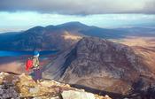 Walker looking to the Aghlas from Errigal Mountain, Co Donegal, Ireland.