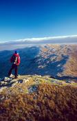Winter walker near the summit of Lavagh Beg, Bluestack Mountains, County Donegal, Ireland.