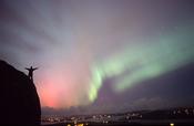 Northern lights and figure silhouetted, Grianan an Aileach, Co Donegal, Ireland.
