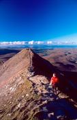 Walker approaching the summit of Errigal Mountain, Co Donegal, Ireland.