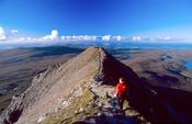Walker nearing the summit of Errigal Mountain, Co Donegal, Ireland.