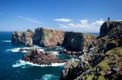 Walker admiring the cliffs of Dun Balair, Tory Island, Co Donegal, Ireland.