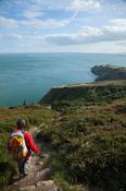 Walkers heading towards Baily Lighthouse, Howth Coatal Path, County Dublin, Ireland.