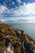 Walker near Red Rock, Howth Coatal Path, County Dublin, Ireland.