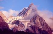 Evening cloud around the Chamonix Aiguilles, French Alps, France.