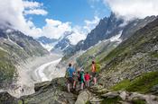 Hiking family above Mer de Glace glacier, Chamonix Valley, French Alps, France.