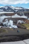 Hikers on the Laugavegur trail  near Storihver hot springs, Hrafntinnusker. Central Highlands, Sudhurland, Iceland.