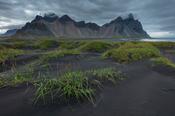 Vestrahorn Mountain rises above the black sand beach at Stokksnes. Hofn, south east Iceland.