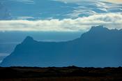 Vatnajokull ice cap towers over a mountain ridge in Skaftafell National Park, Sudhurland, south east Iceland.
