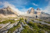 Hiker beneath Tre Cime di Lavaredo, Sexten Dolomites, South Tyrol, Italy. image
