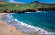 Person walking on Clogher Beach, Dingle Peninsula, Co Kerry, Ireland.