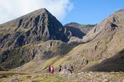 Walkers in Hag's Glen beneath Carrauntoohil, MacGillycuddy's Reeks, County Kerry, Ireland.