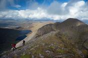 Walkers on the ridge between Carrauntoohil and Beenkeragh, MacGillycuddy's Reeks, County Kerry, Ireland.