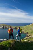 Walkers on the Dingle Way above Slea Head, Dingle Peninsula, County Kerry, Ireland.