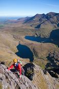 Rock climber on Howling Ridge, above Hag's Glen, Carrauntoohil, MacGillycuddy's Reeks, County Kerry, Ireland.