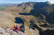 Rock climber on Howling Ridge, above Hag's Glen, Carrauntoohil, MacGillycuddy's Reeks, County Kerry, Ireland.