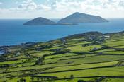 Scarriff and Deenish Islands beyond green fields, Caherdaniel, County Kerry, Ireland.