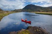 Canoeing on The Long Range, Killarney Lakes, Killarney National Park, County Kerry, Ireland.