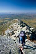 Hiker climbing Mount Katadhin, Baxter State Park, Maine, USA.