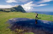 Walker heading towards Knockmore, Clare Island, County Mayo, Ireland. image