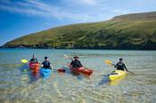 Sea kayakers in Portacloy Bay, Co Mayo, Ireland.