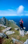 Walker looking towards Achill Head from Croaghaun, Achill Island, Co Mayo, Ireland.