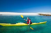 Sea kayaking beside Inishkea South Island, County Mayo, Ireland.