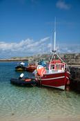 Boats moored beside the pier on Inishkea South Island, County Mayo, Ireland. image