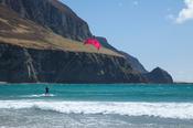 Sophie Mathews kitesurfing beneath Minaun Cliffs, Achill Island, County Mayo, Ireland.
