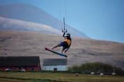 Kitesurfer Francois Colussi launching an aerial, Keel Lough, Achill Island, County Mayo, Ireland.