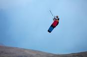 Kitesurfer Francois Colussi launching an aerial, Keel Lough, Achill Island, County Mayo, Ireland.