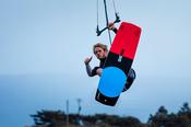 Kitesurfer Francois Colussi launching an aerial, Keel Lough, Achill Island, County Mayo, Ireland.