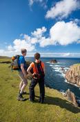 Hikers at the tip of Erris Head, Belmullet, County Mayo, Ireland.