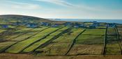 Coastal cottages and green fields at Carrowteige, County Mayo, Ireland. image