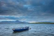 Fishing boat moored in Clew Bay, with Croagh Patrick behind. County Mayo, Ireland.