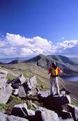 Walker near the summit of Glennamong, Nephin Beg Mountains, Co Mayo, Ireland.